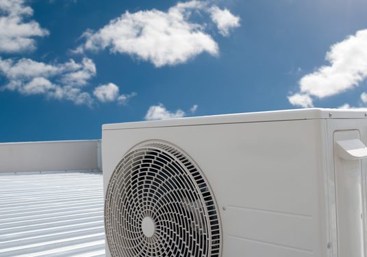 White air conditioning unit on a roof