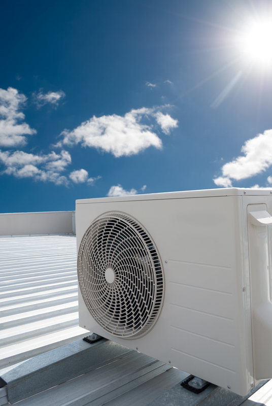 White air conditioning unit on a roof White air conditioning unit on a roof Air conditioning maintenance for businesses Dorset